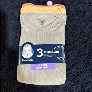 Gerber Newborn Onesies in Green, Orange, and Yellow